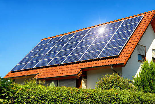 Solar panels installed beside a farm